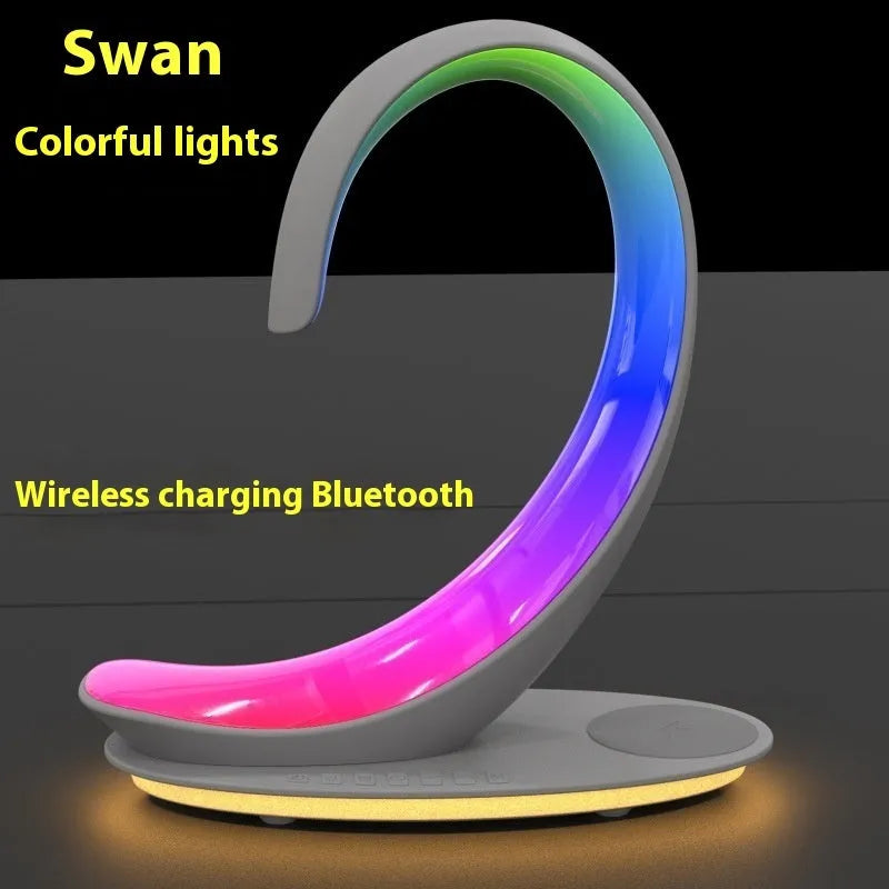 White swan-shaped desktop wireless charger Bluetooth speaker with colourful LED atmosphere lighting