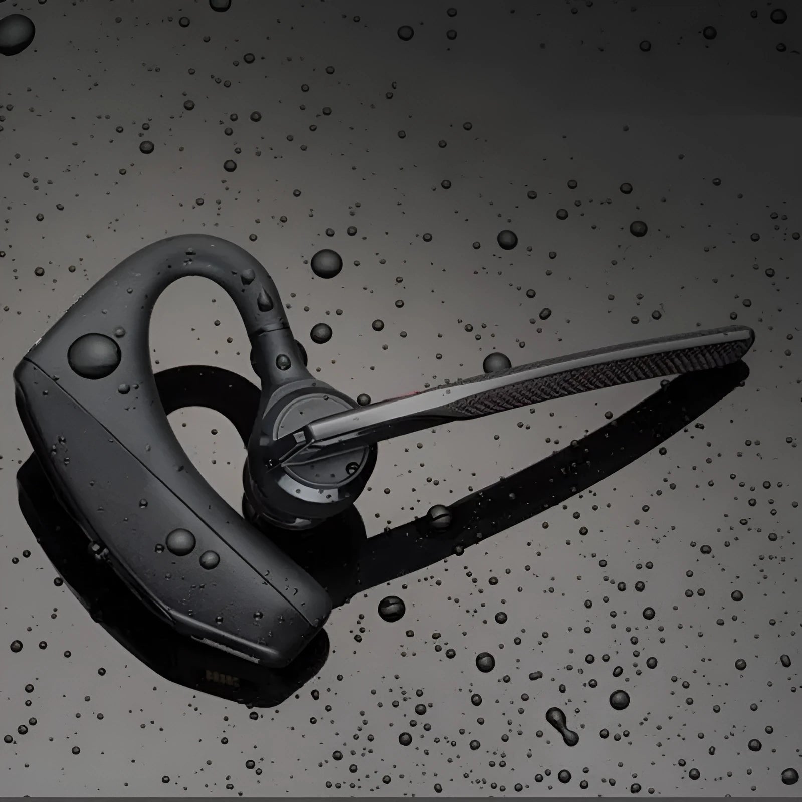 Black Bluetooth sports headphones with minimalist design showing battery display and USB connectivity