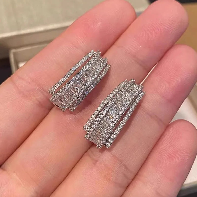 Geometric white gold colour stud earrings with zircon stone detail for women
