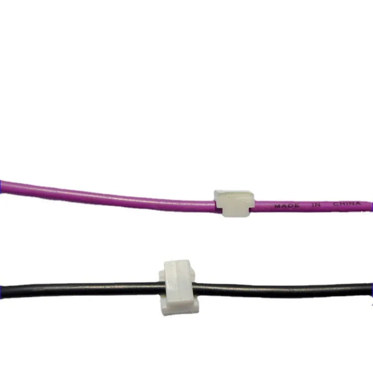 Black PA66 plastic wiring management clips for automotive and electronic cable organisation.