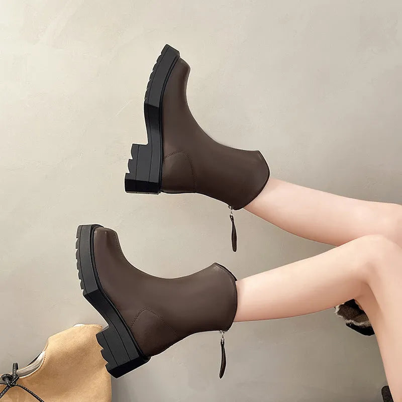 Black platform Martin boots for women with a square toe, back zipper, and a high heel.