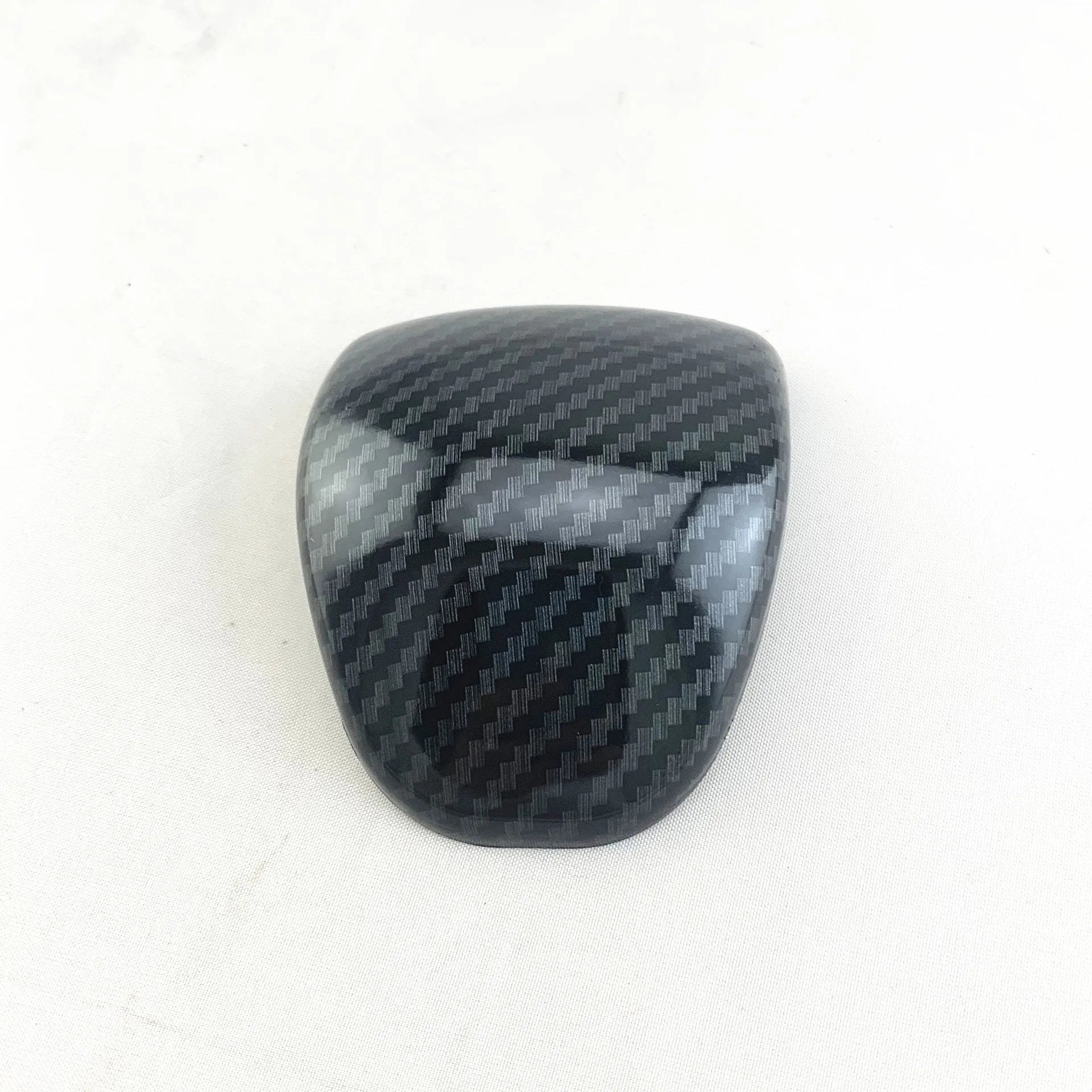 Car gear shift cover with carbon fibre pattern finish