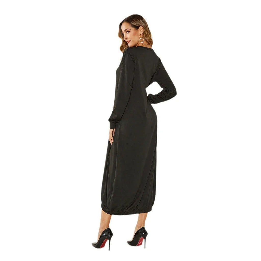 Black loose lantern dress with lace-up crew neck detail on a hanger.