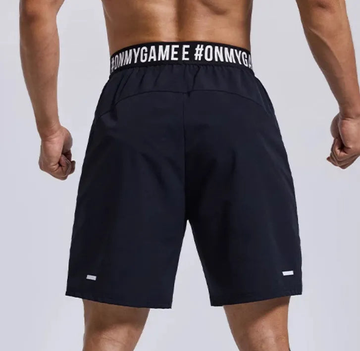Men's loose grey sports shorts with elastic fly opening and letter detailing for athletic wear