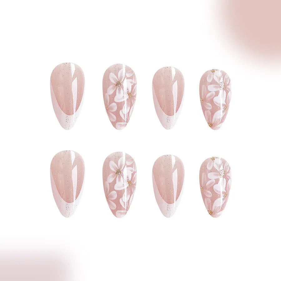 Removable short almond nails with French style finish and glitter flower decoration in colour C625