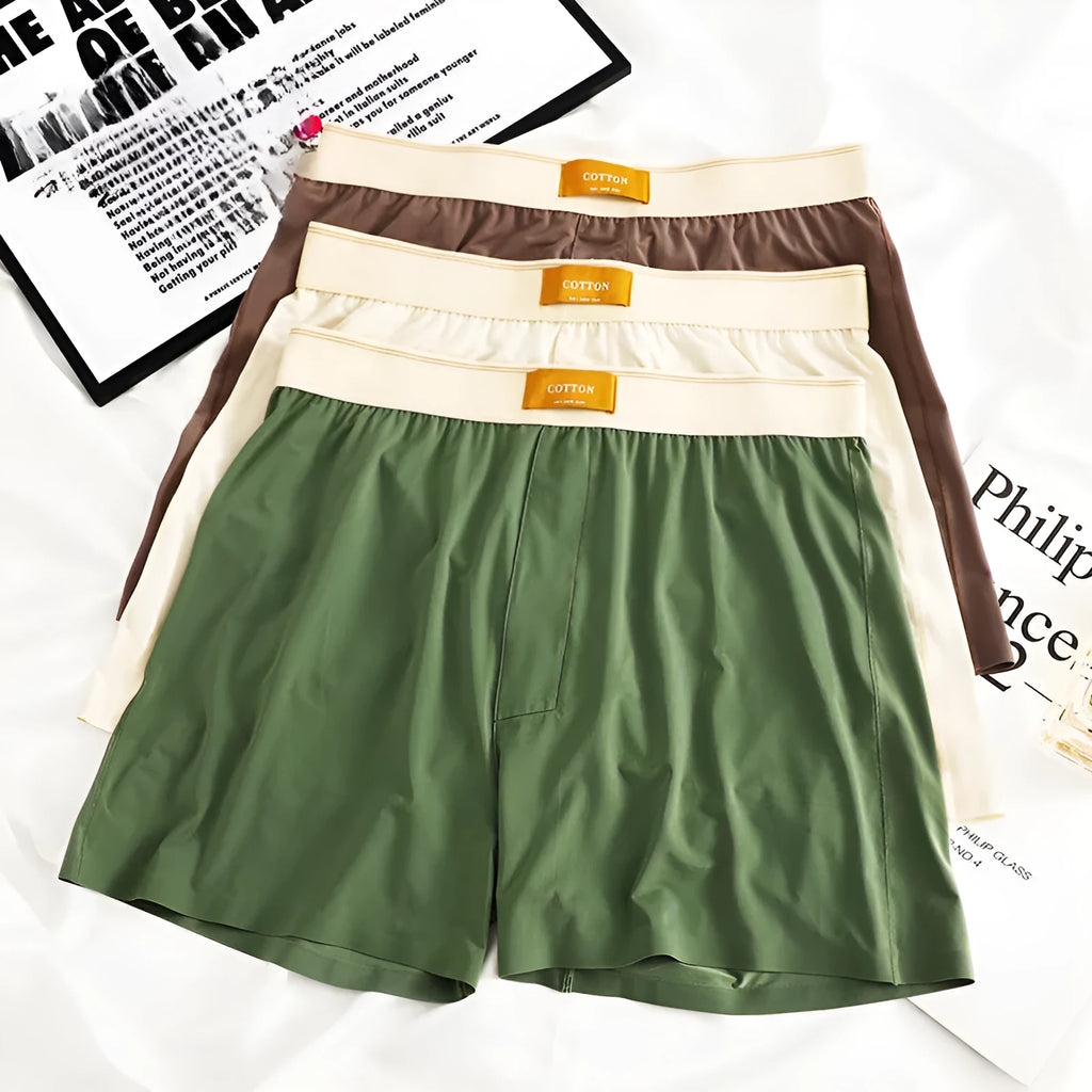 A pack of three pairs of solid colour men's ice silk loose fit boxer shorts.