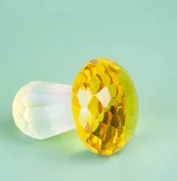 Colourful white crystal mushroom decoration in geometric modern style, 40mm by 53mm.