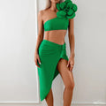 Women's black two-piece bikini swimsuit with 3D floral pattern, shown on a mannequin.