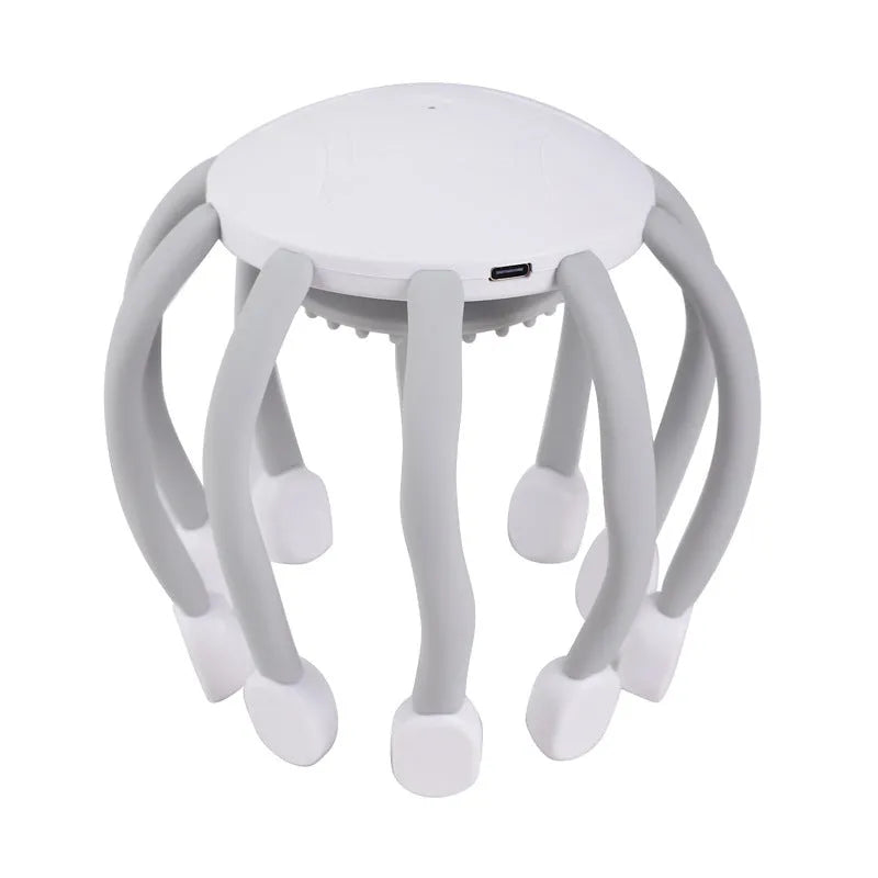 A black head massager with multiple claws, connected via a USB cable, showing its four-mode control buttons.