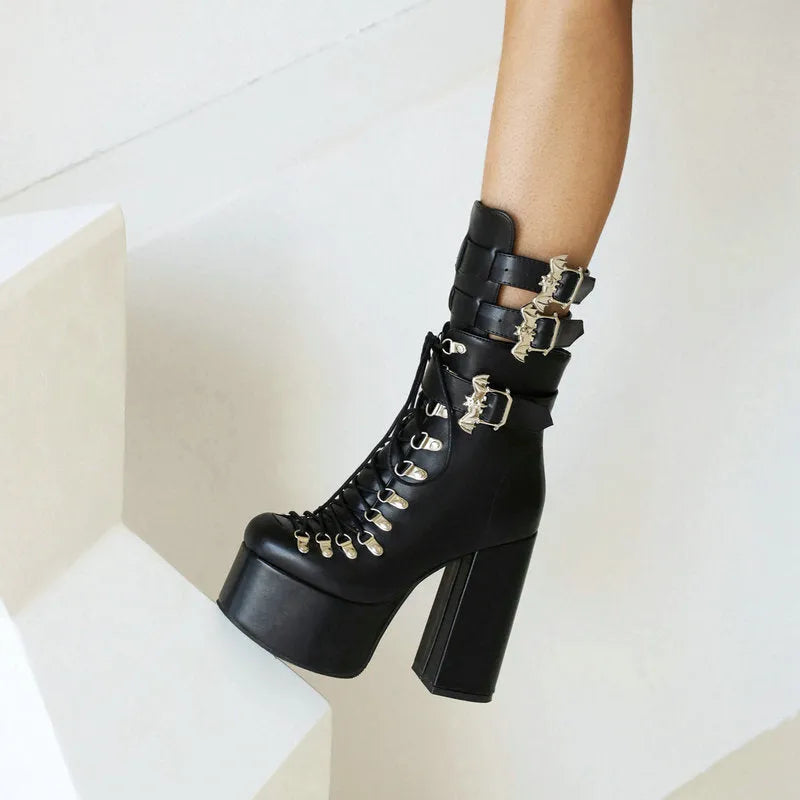 Chunky high-heel platform thigh-high boots in black patent leather with front lacing and block heel