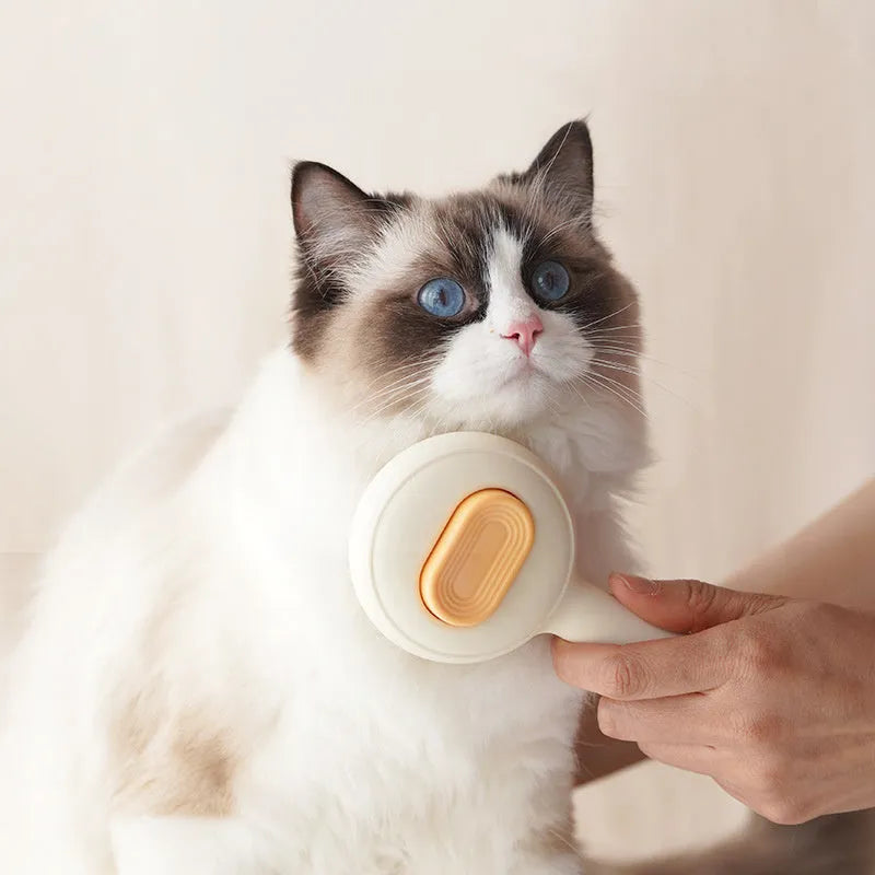 Green or yellow cat grooming brush with stainless steel comb teeth and a non-slip plastic handle.