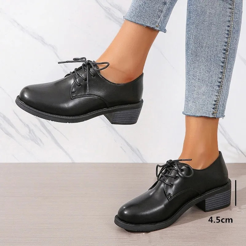 Black women's low-top work shoes with chunky heel and soft leather sole