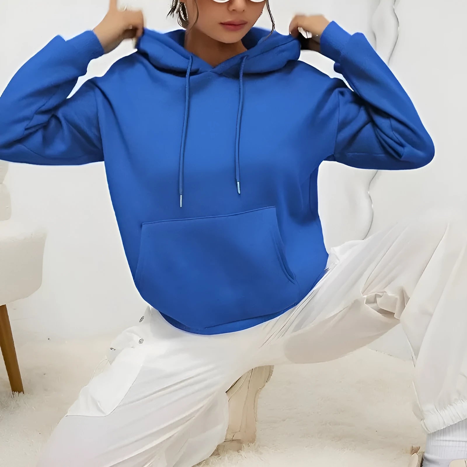 Women's loose grey drawstring hood sweatshirt with front pocket, long sleeves