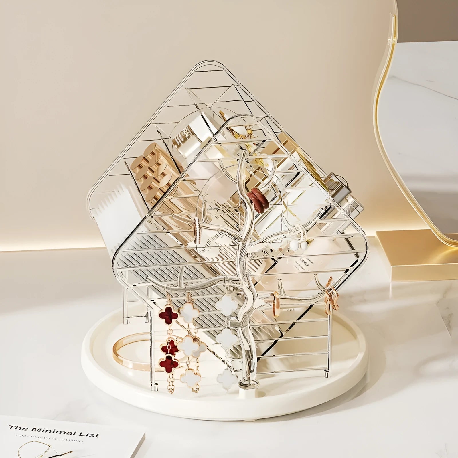 Rotating clear plastic cosmetic storage box organiser on a table.