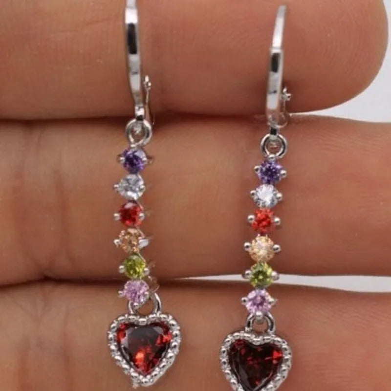 A pair of gold-coloured heart-shaped metal earrings for women.