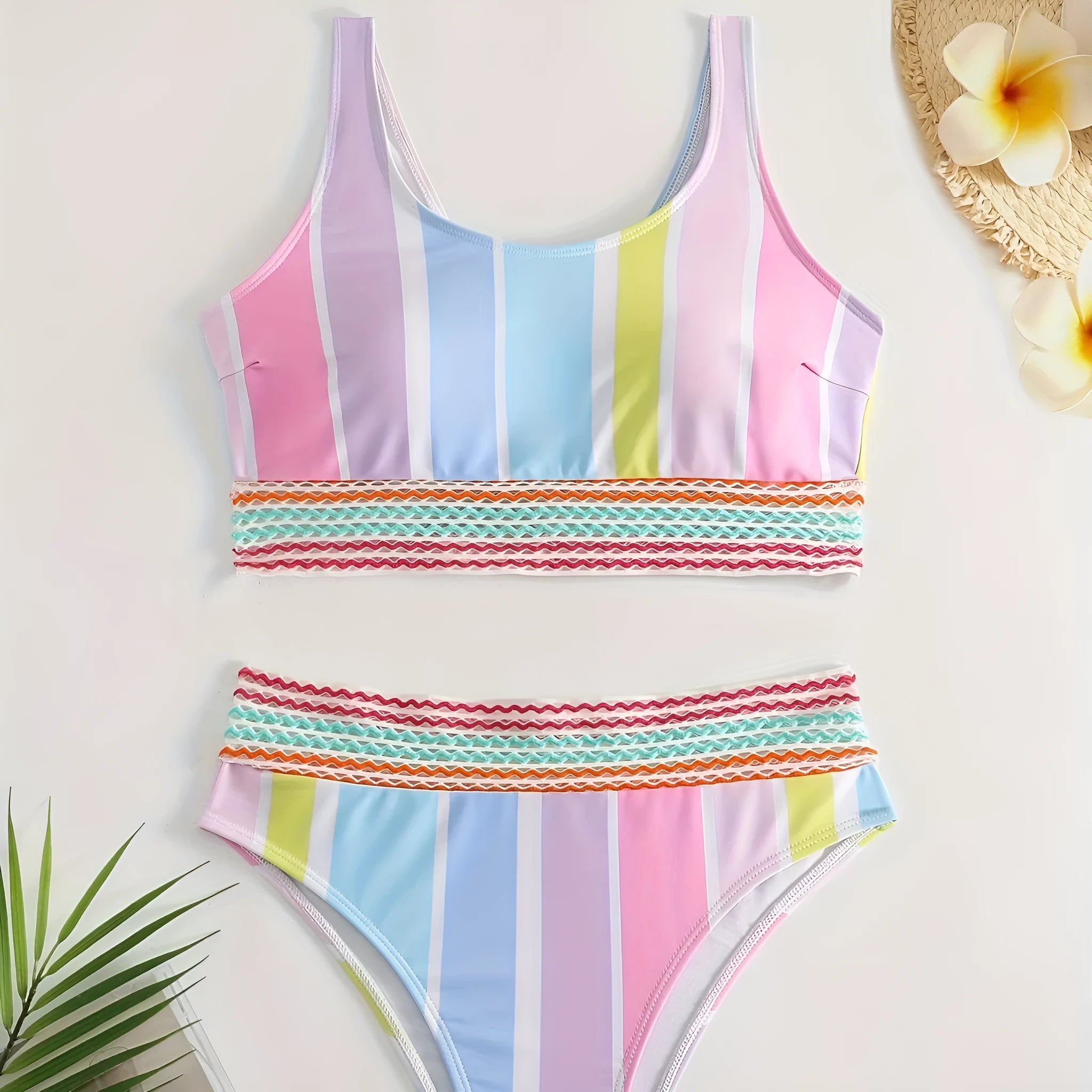 Women's striped sports bikini top and briefs set on a white background