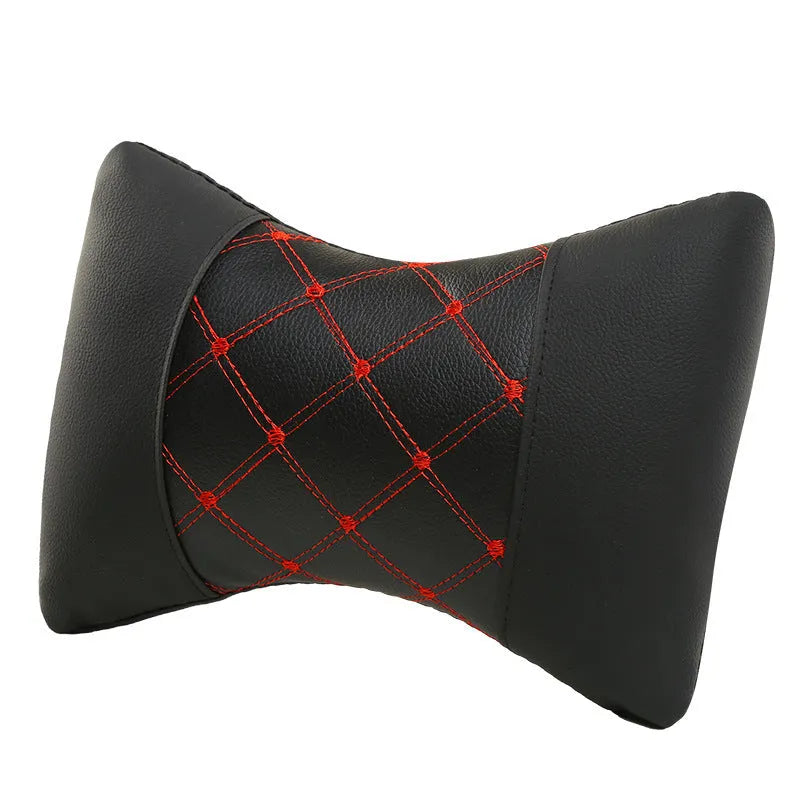 Black quilted car headrest cushion with diamond pattern for neck support.