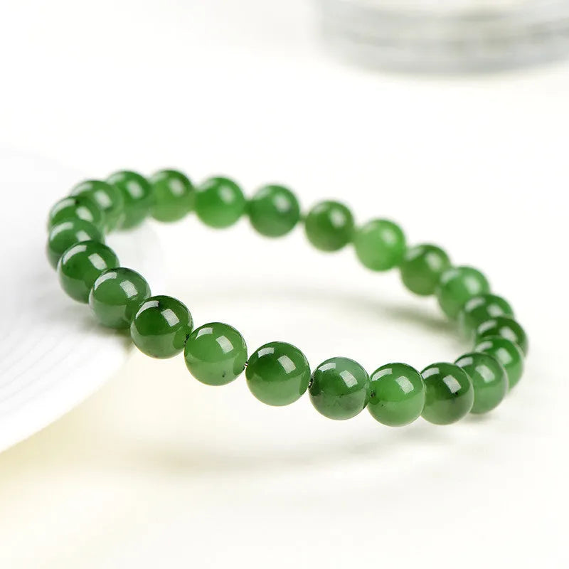Natural Hetian jade jasper bead bracelet with polished finish showing earth-toned beads strung together