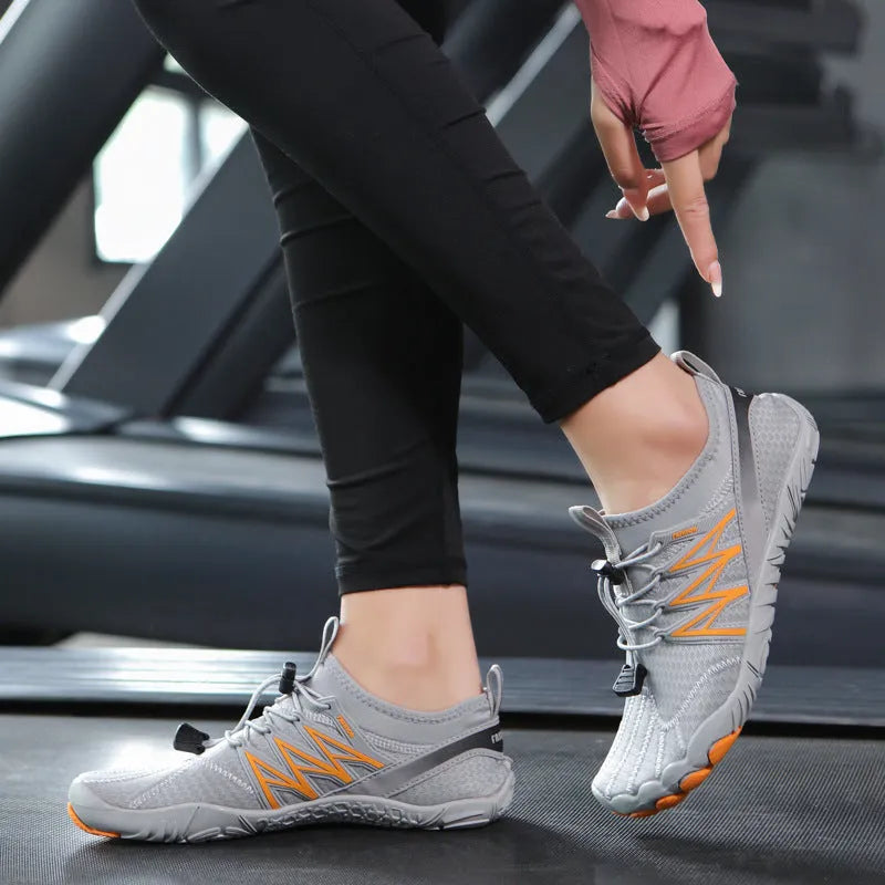 Indoor fitness training shoes in striped design with low-top profile and rubber sole.