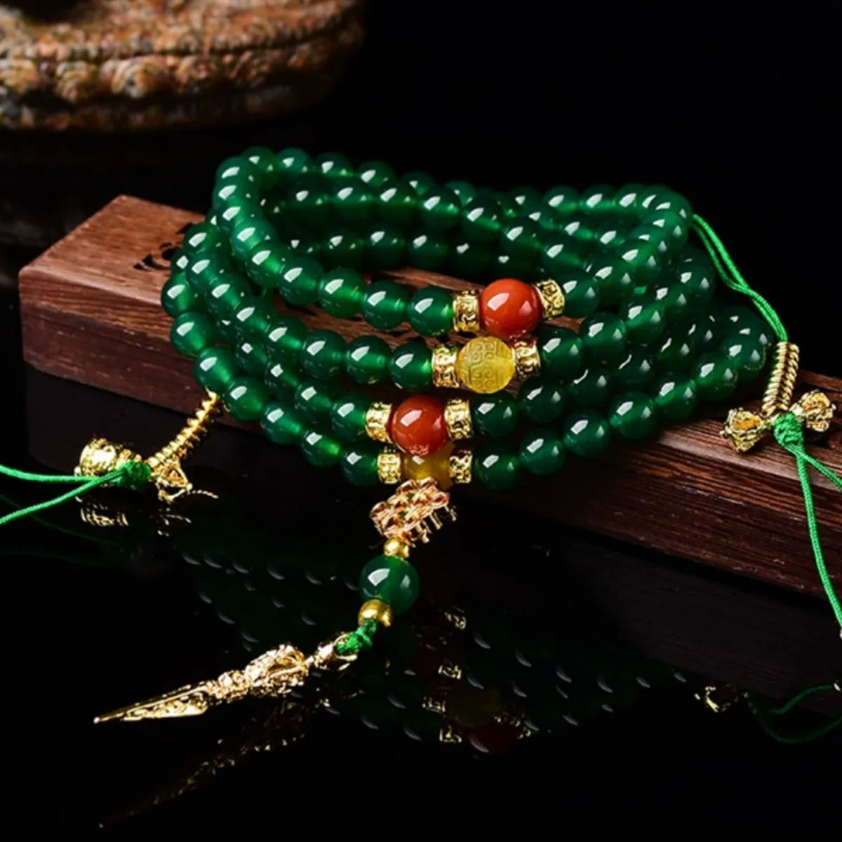 Multi-strand green agate bracelet for men and women on wrist, showing natural stone beads.