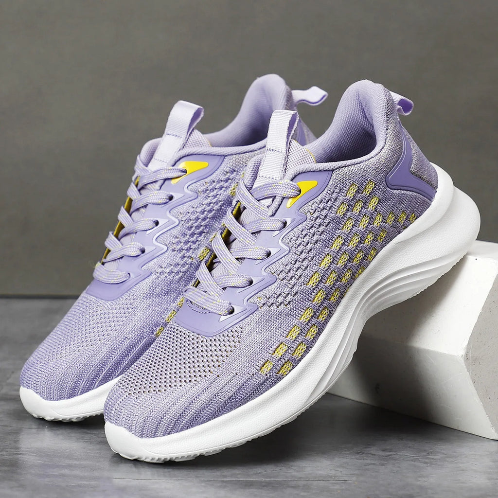 Women's lavender purple Flyknit running shoes with mesh lining and EVA sole on a white background.