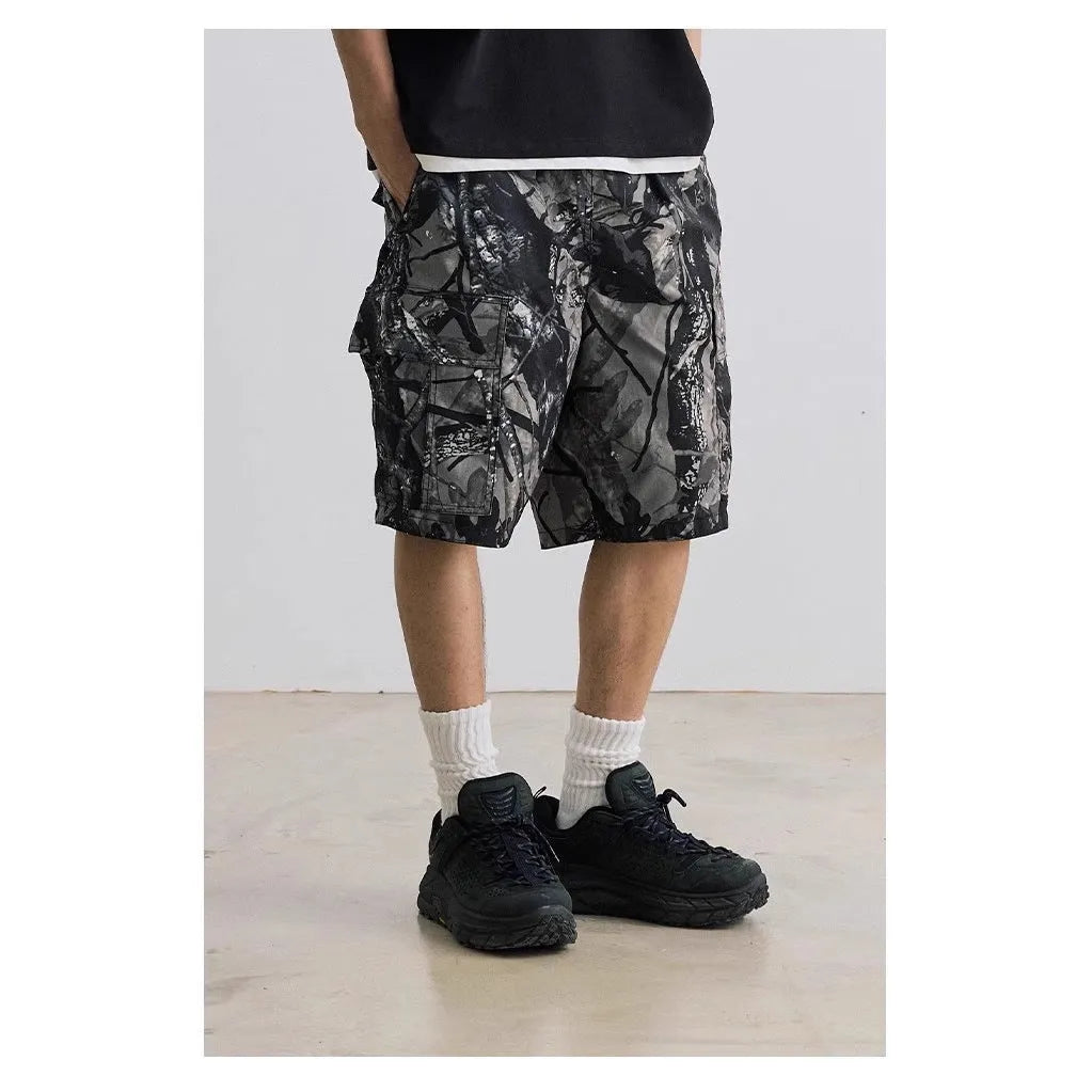 Loose fit straight-leg denim shorts on hanger, showing micro-elastic waistband and zip fly in army green colour.