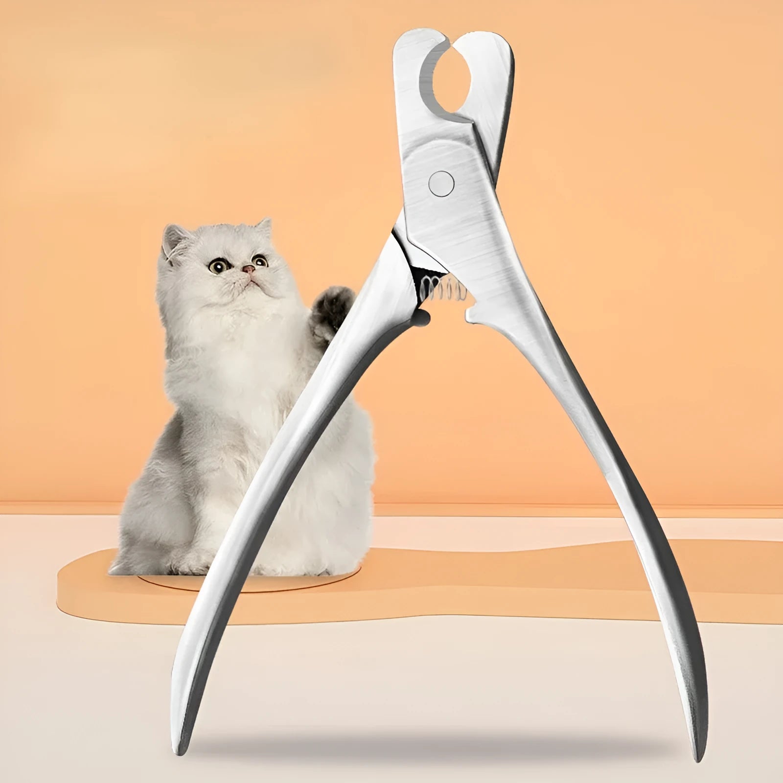 Silver stainless steel pet nail clipper with safety guard and ergonomic handles.
