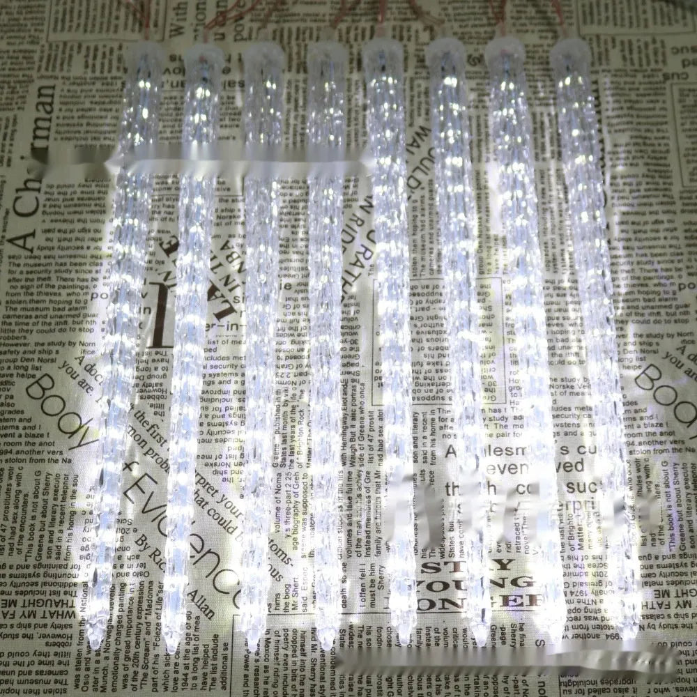 Solar-powered LED ice cone meteor shower festoon lamp with remote control on a bracket.