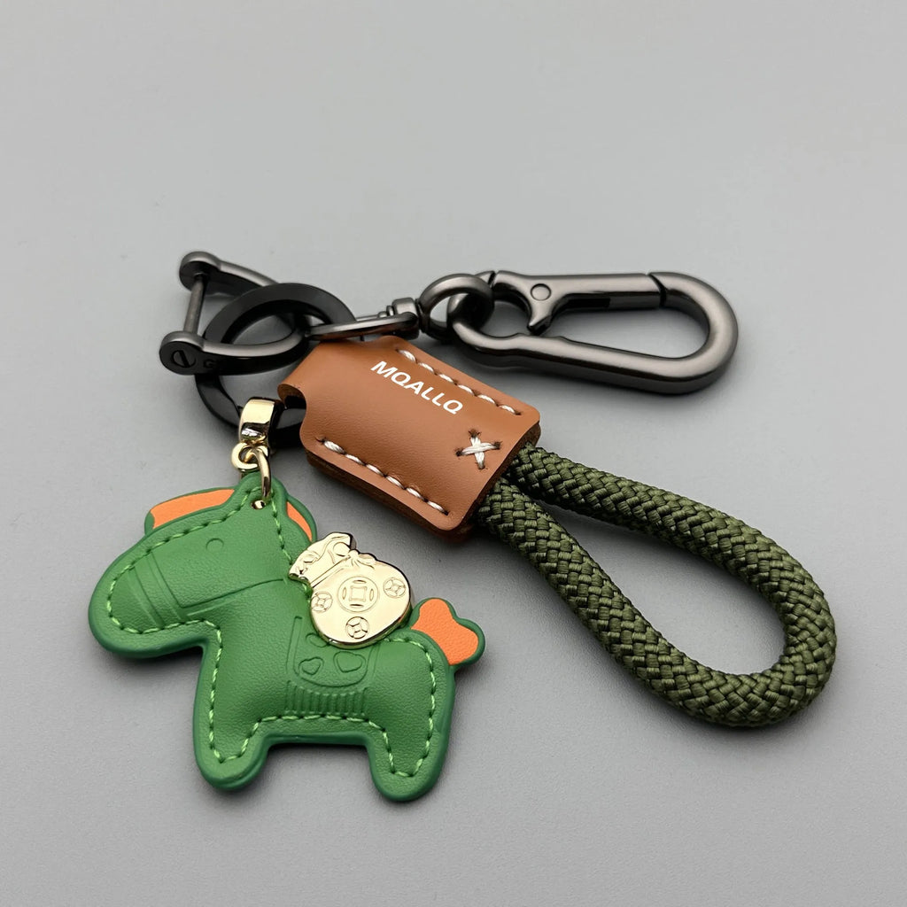Handmade cowhide car keychain pendant with a zinc alloy pony buckle and coloured flanelle rope strap.
