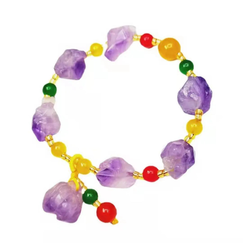 Natural purple amethyst bead bracelet for women with a fu character charm on a white background.
