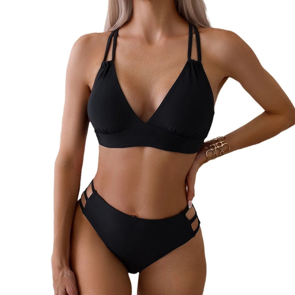 Adult women's black V-neck halter bikini with split-leg high-cut shorts.