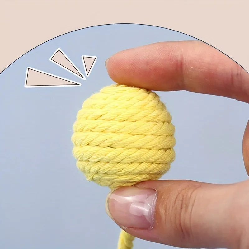 Cat toy ball with rope and bell inside in green, pink, purple, and yellow colours