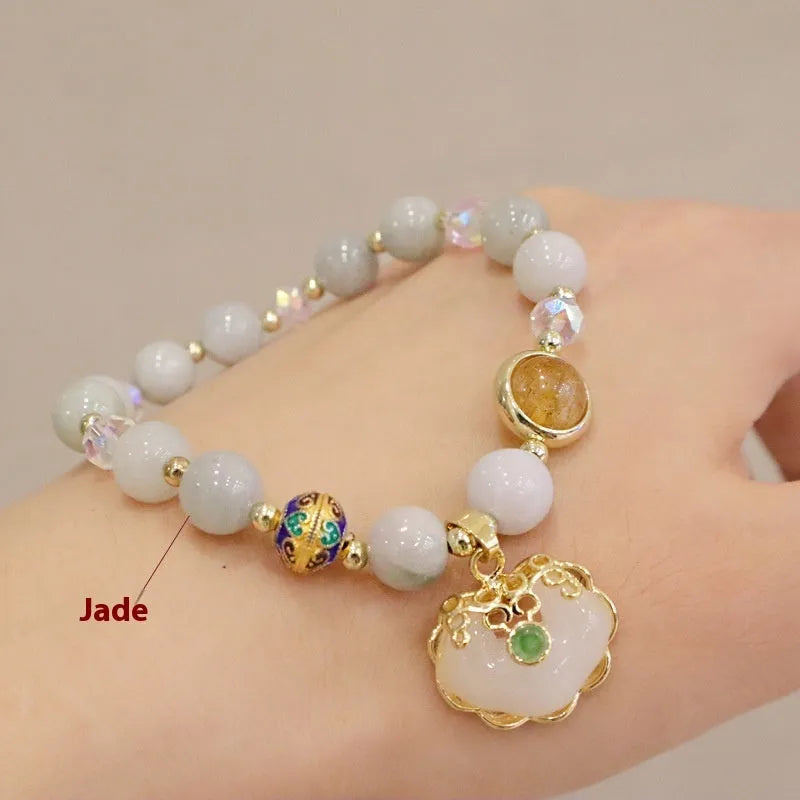 Gray jade and strawberry quartz women's bracelet with geometric ethnic metal decorations