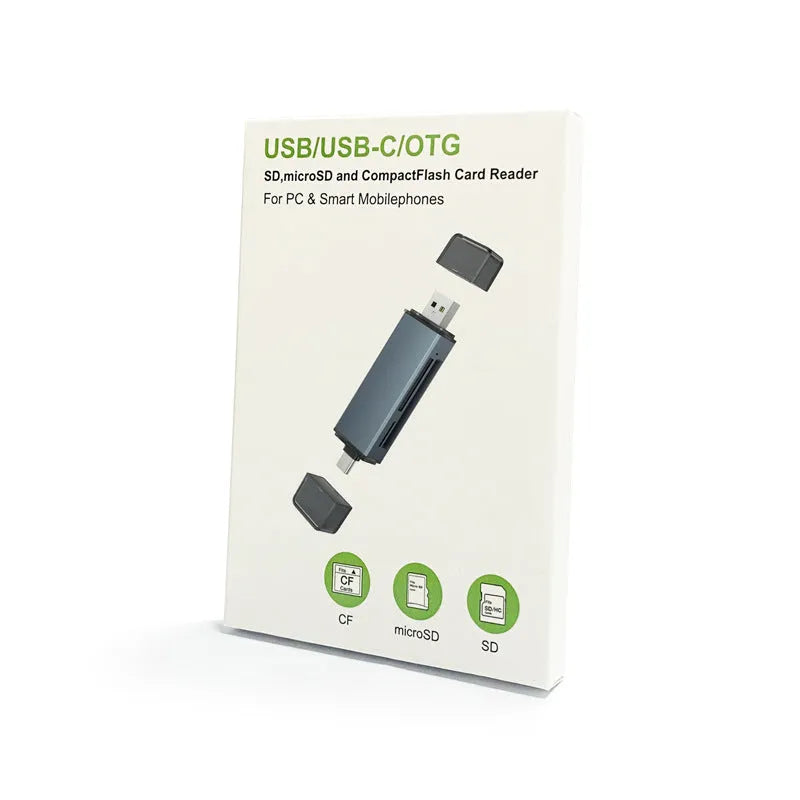 Silver aluminium alloy USB card reader with CF, SD, and TF slots on a desk.