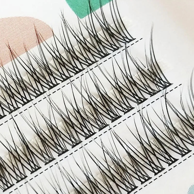 Black V-shaped fairy fishtail false eyelashes with thick segmented design ranging from 8mm to 12mm in length.