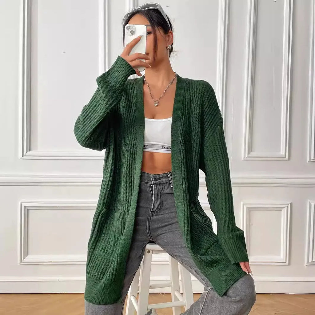 Women's dark green loose-fit cardigan with two front pockets and long sleeves