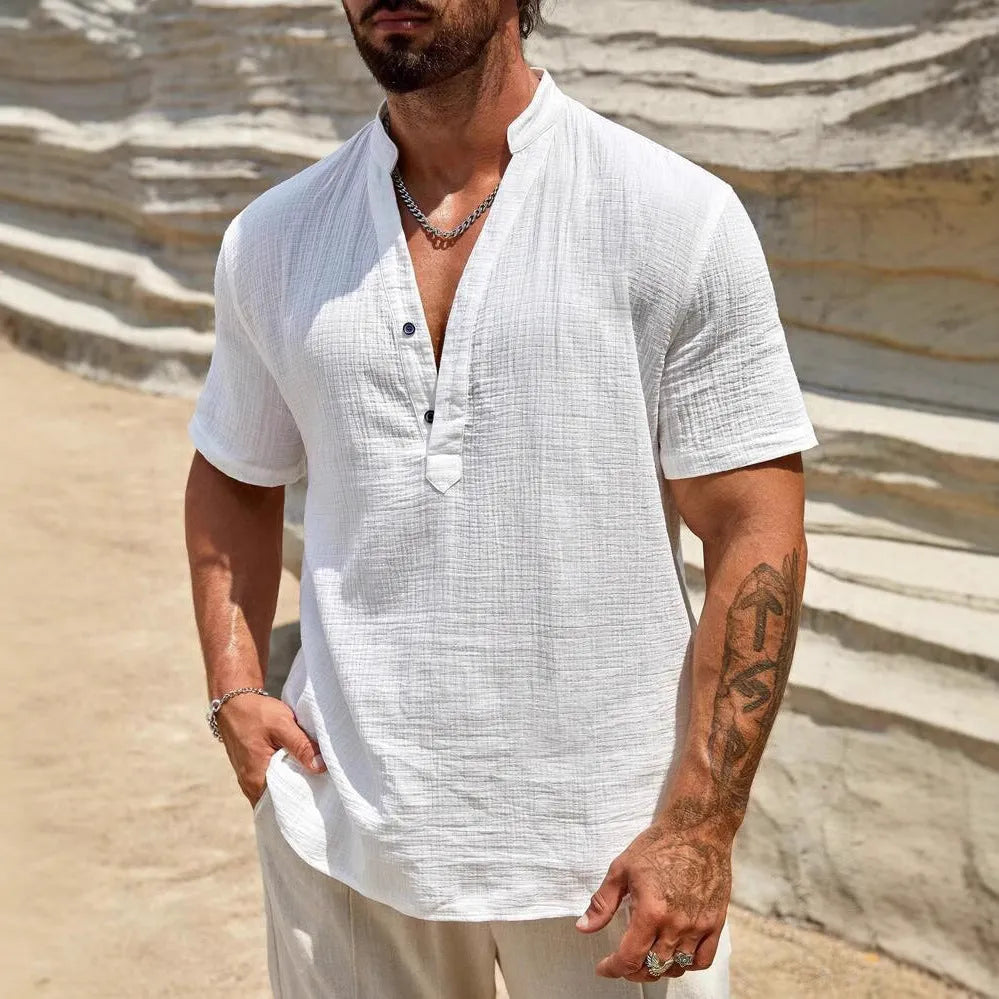 Man wearing a light blue short-sleeved stand collar shirt made from thin polyester blend fabric