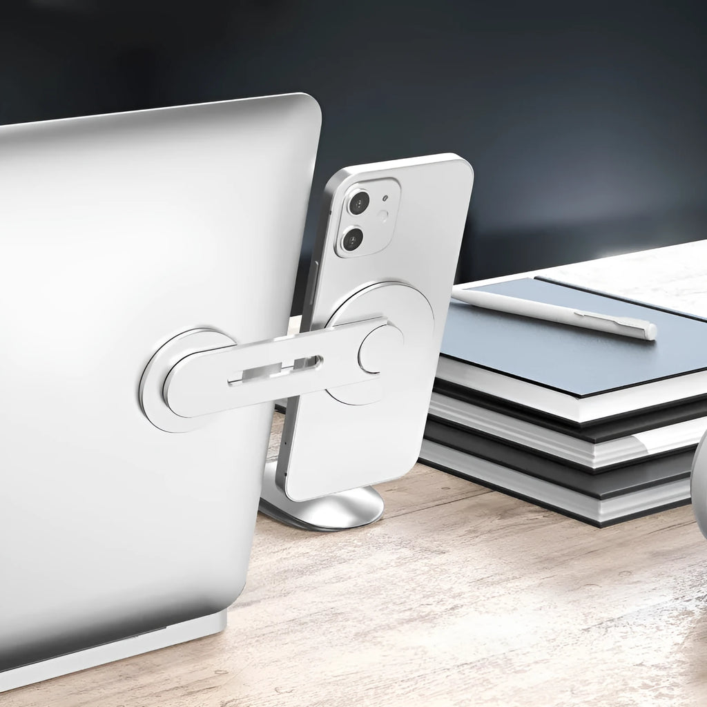 Silver aluminium alloy magnetic suction car phone holder on a grey background, showing its slim profile.