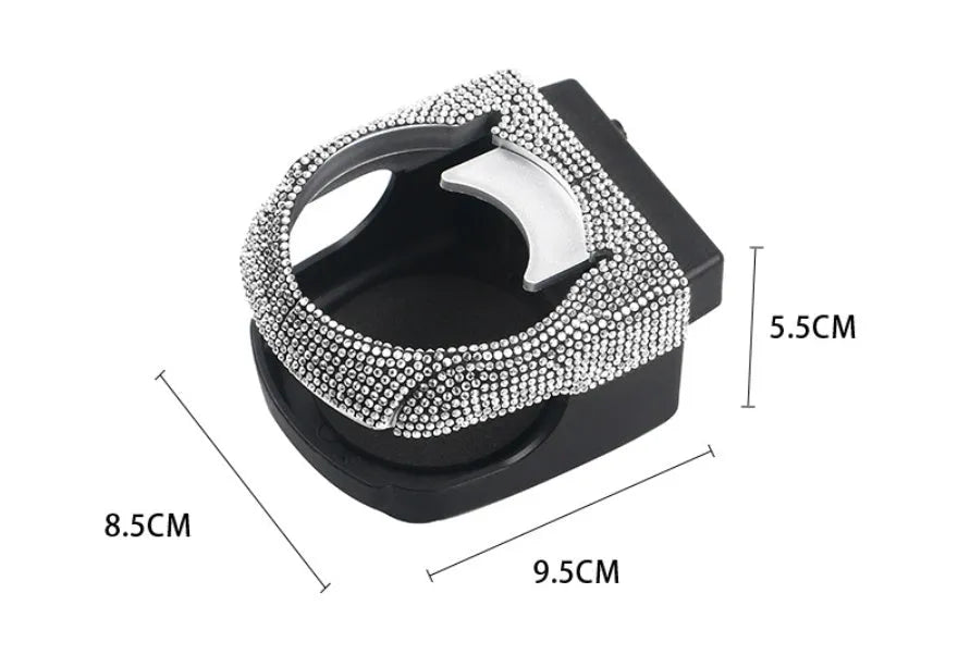 Car interior water cup bracket with decorative diamond accents mounted on air vent