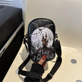 Halloween graffiti crossbody phone bag with cartoon pumpkin, ghost, and bat print in black.