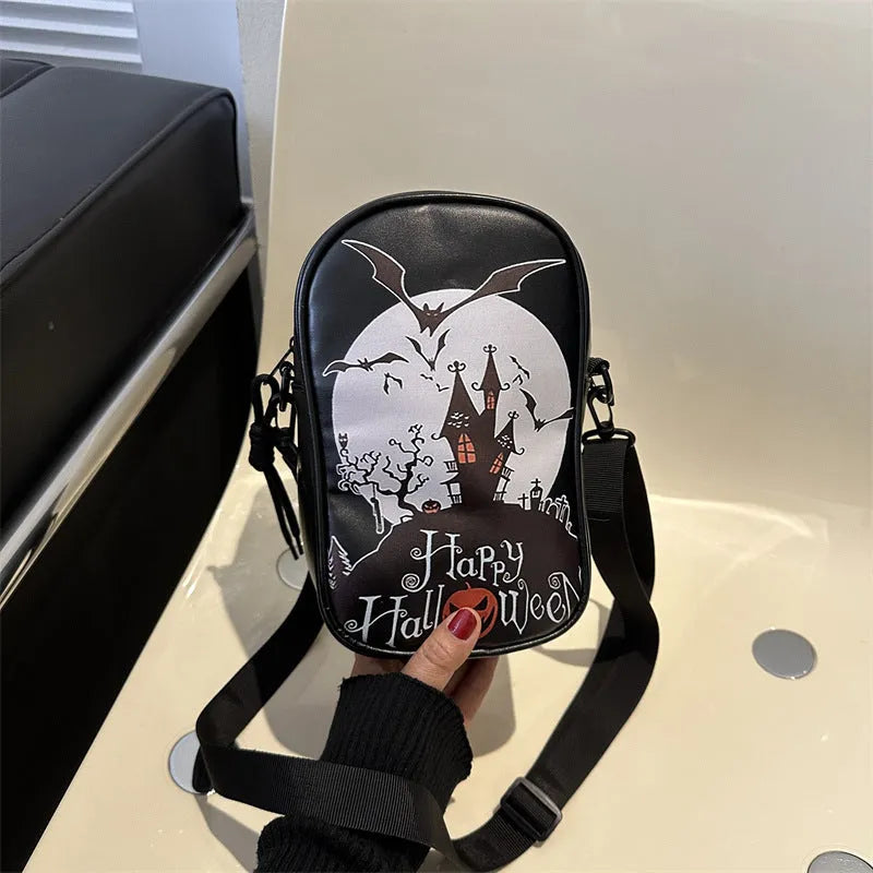 Halloween graffiti crossbody phone bag with cartoon pumpkin, ghost, and bat print in black.