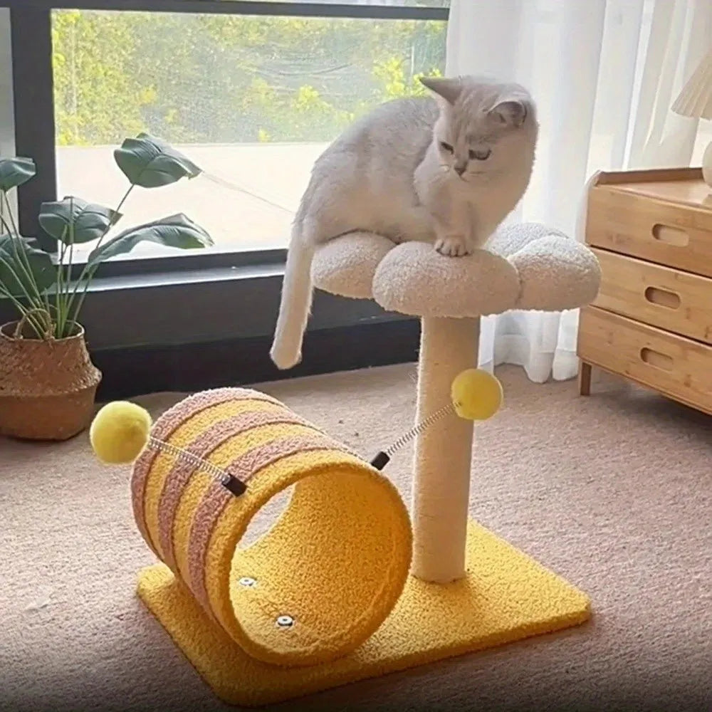 Yellow cat tree with sisal scratching posts and a fabric tunnel.