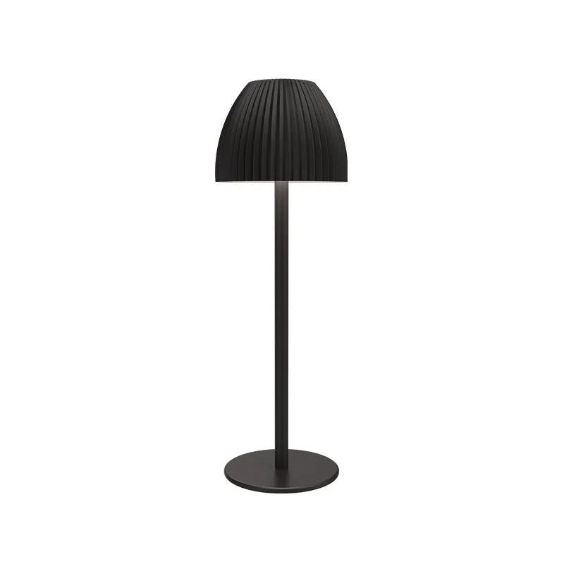 Ins pattern dimmable night lamp with thin round base in black or white, placed on a bedside table.