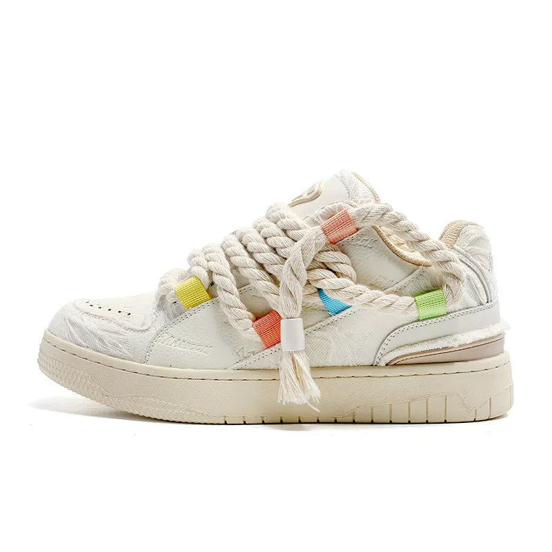 Cream white retro lace-up skateboard shoes with platform sole on a plain background