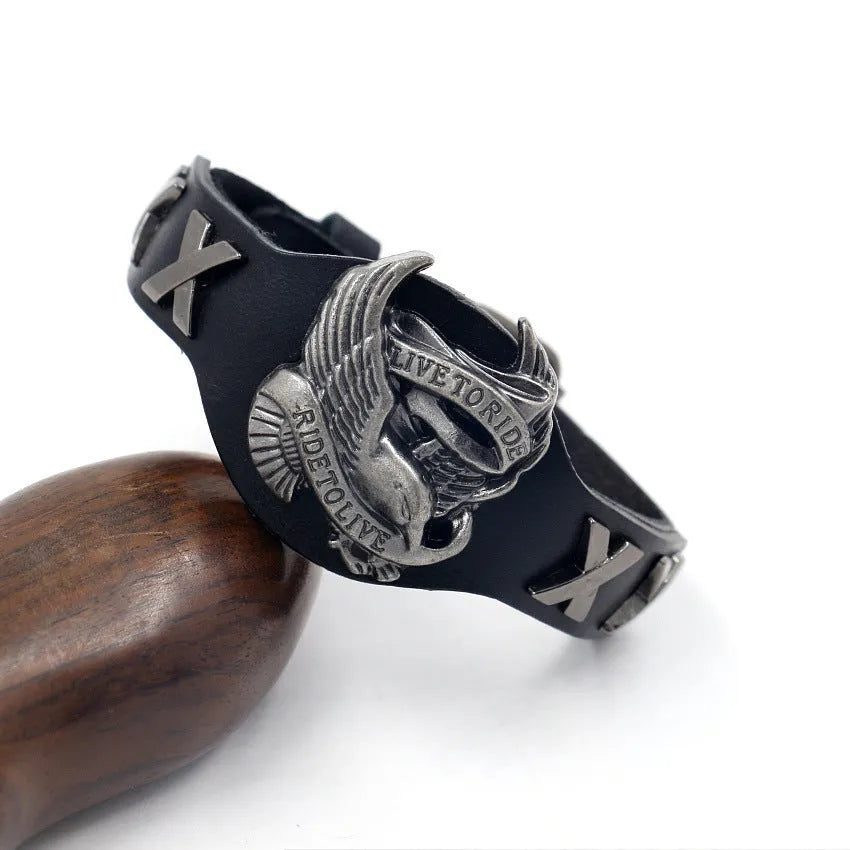 Black geometric leather men's bracelet with a detailed alloy eagle buckle clasp on a white background.
