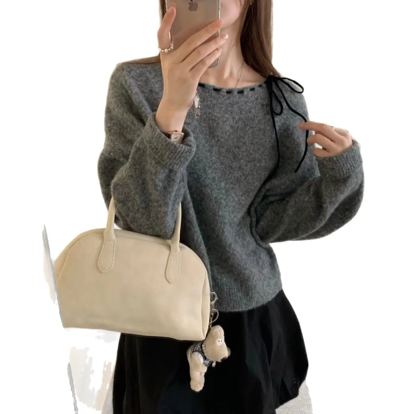 Women's loose grey knitwear pullover jumper on a hanger