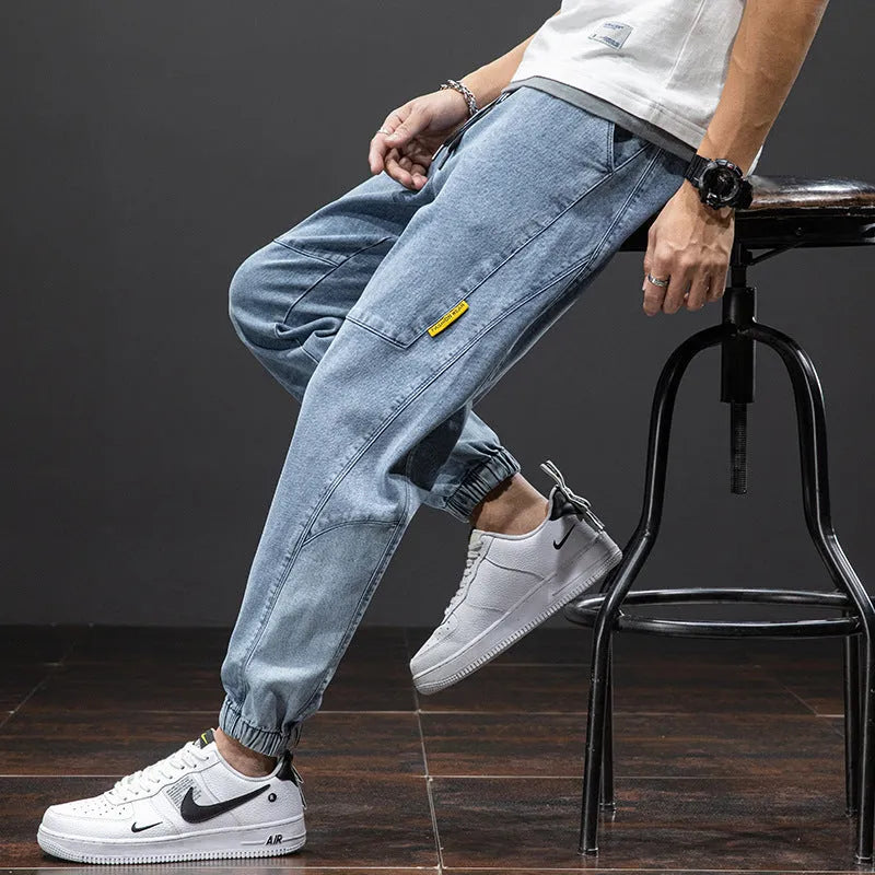 Men's loose fit straight leg cargo jeans in cotton with micro elasticity, shown in blue.