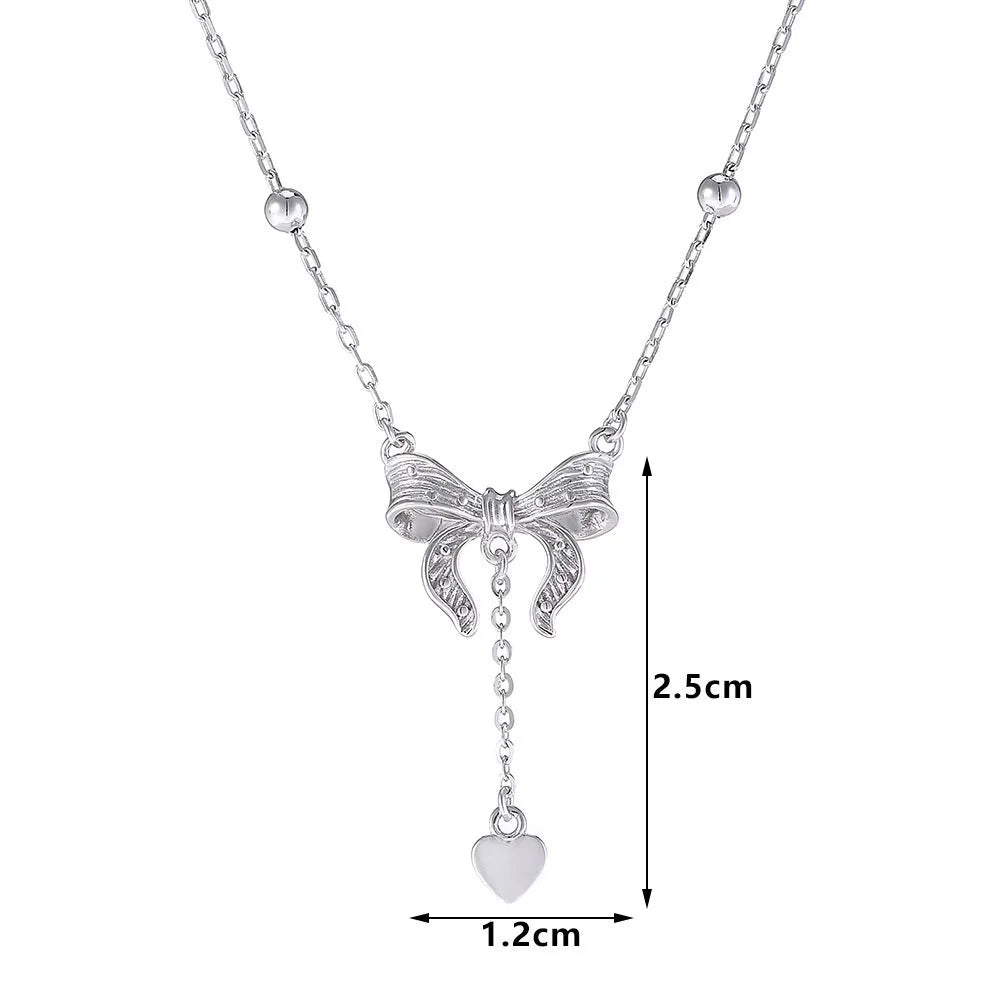 S925 sterling silver adjustable clavicle chain with a heart and butterfly pendant.