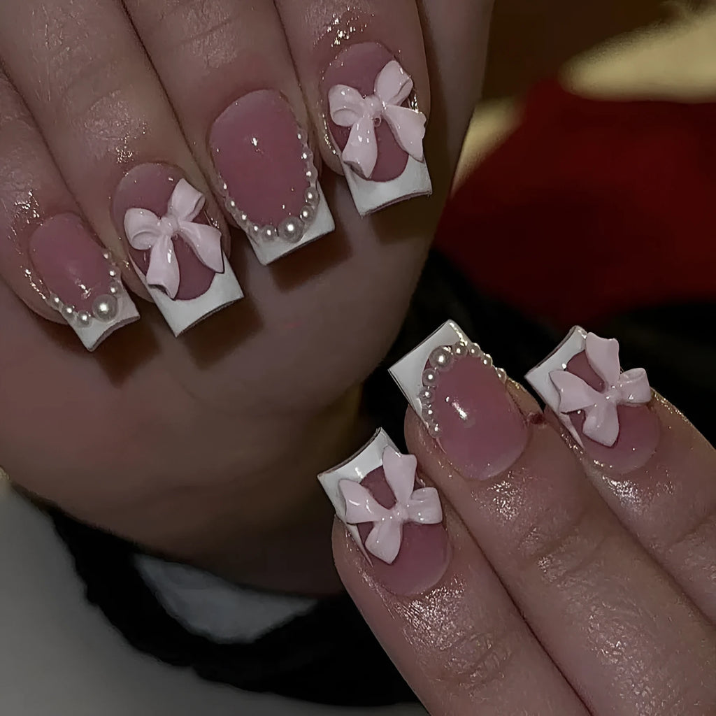 Set of short white French manicure nail art stickers showing bow, tulip, starry sky, and leopard print patterns.