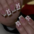 Set of short white French manicure nail art stickers showing bow, tulip, starry sky, and leopard print patterns.